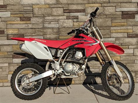 THE HONDA CRF150R IS ONE MEAN BIKE, PRIMARILY USED FOR RACING BUT CAN BE TRAIL RODE AS WELL THIS 150R IS THE EXPERT EDITION WHICH FEATURES THE LARGER FRONT AND REAR WHEELS (19" AND 16"), 34" SEAT HEIGHT, AND SLIGHTLY MORE TRAVEL IN THE REAR SUSPENSION. . Crf150r for sale